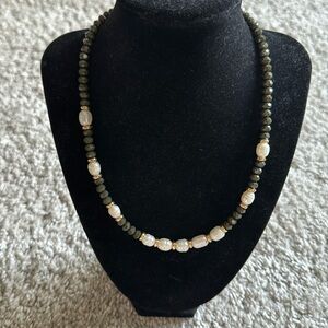 Beautiful freshwater pearl necklace with green beads.